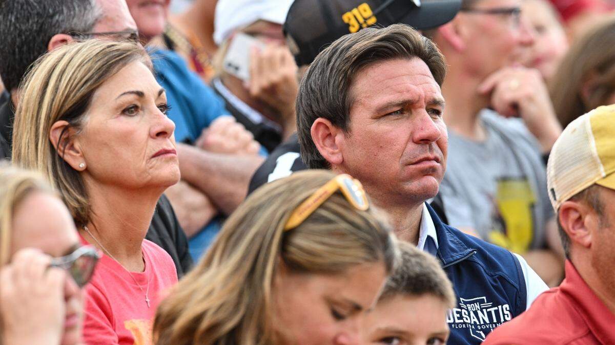 Iowa Gov. Kim Reynolds (left.) and Florida Gov. Ron DeSantis attend a football game in Jack Trice Stadium in Ames, Iowa, on Sept. 9, 2023.