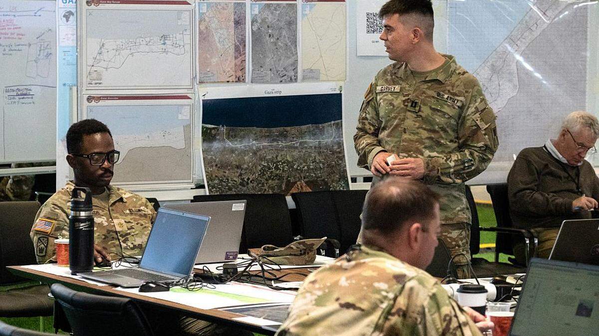 Personnel work at the US-led Civil-Military Coordination Centre (CMCC), a command centre where the United States and allied forces coordinate with Israeli counterparts to monitor the truce in Gaza, in the southern Israeli town of Kiryat Gat on November 19, 2025. Israel on November 18 hailed the US president's Gaza peace plan after its endorsement by the UN Security Council, as Hamas rejected the resolution which calls for the deployment of an international force in the Palestinian territory. (Photo by Ahikam Seri / AFP) (Photo by AHIKAM SERI/AFP via Getty Images)