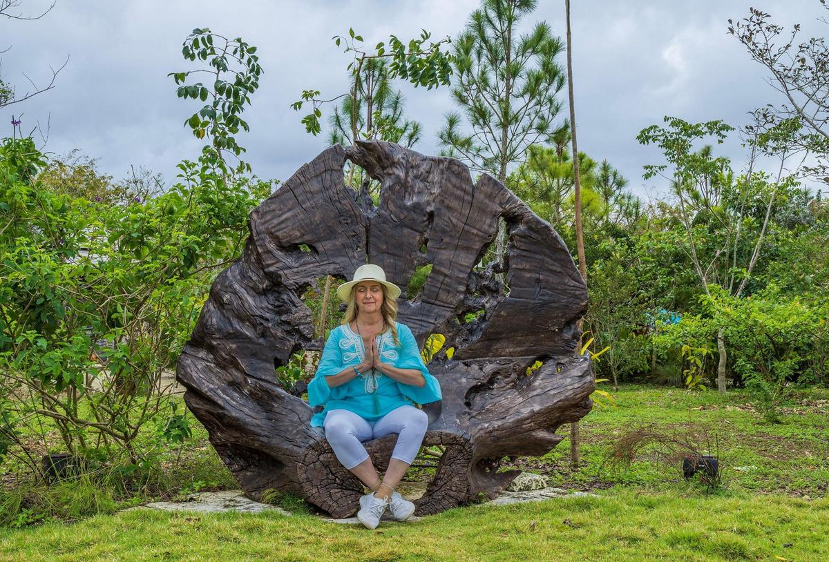 Suzanne Jewell, Chief Experience Officer, meditates in the Meditation Circle at the Patch of Heaven Sanctuary, a 20-acre nature retreat in the Redland.