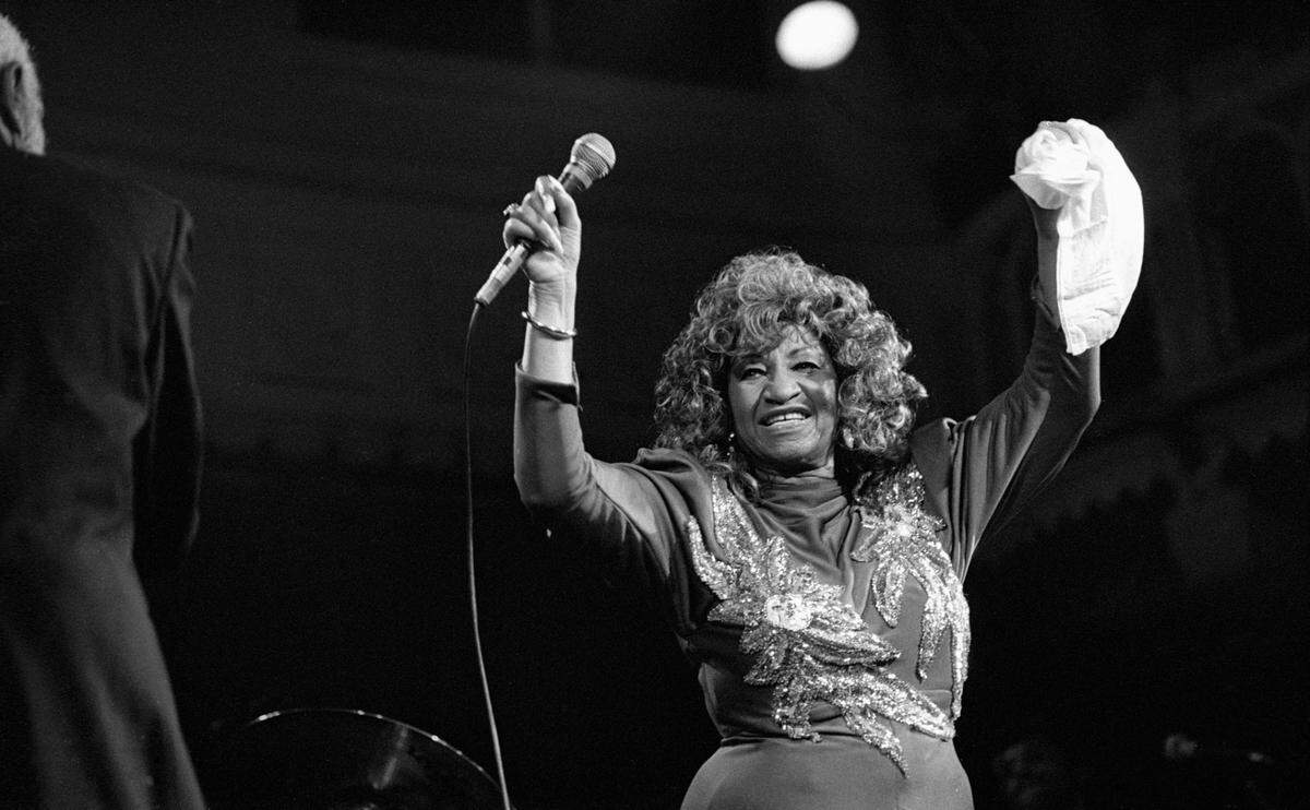 AMSTERDAM, NETHERLANDS - 14th NOVEMBER: Cuban-American singer Celia Cruz (1925-2003) performs live on stage at the Paradiso in Amsterdam, Netherlands on 14th November 1988. (photo by Frans Schellekens/Redferns)