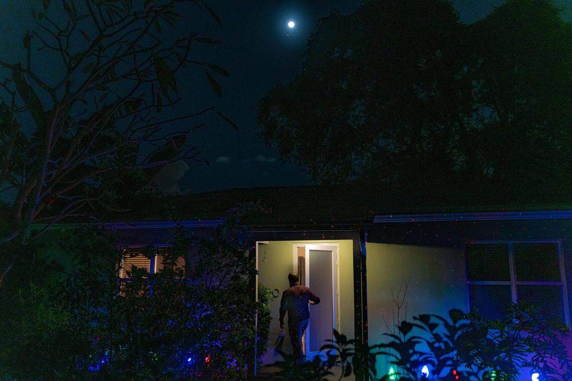 Tanjim Hossain, pictured above, walks into his house in North Miami on Wednesday, December 8, 2022.