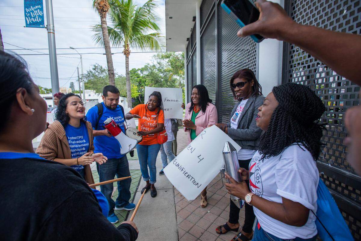Marleine Bastien, director of FANM, joins members of the National TPS Alliance at the Little Haiti Cultural Center in Miami.