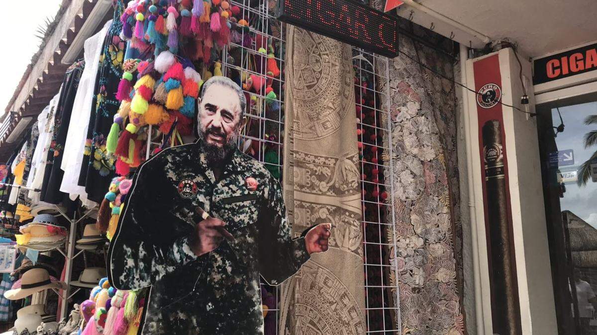 The image of the late Fidel Castro with a cigar in hand serves to promote a business at Playa del Carmen, México.