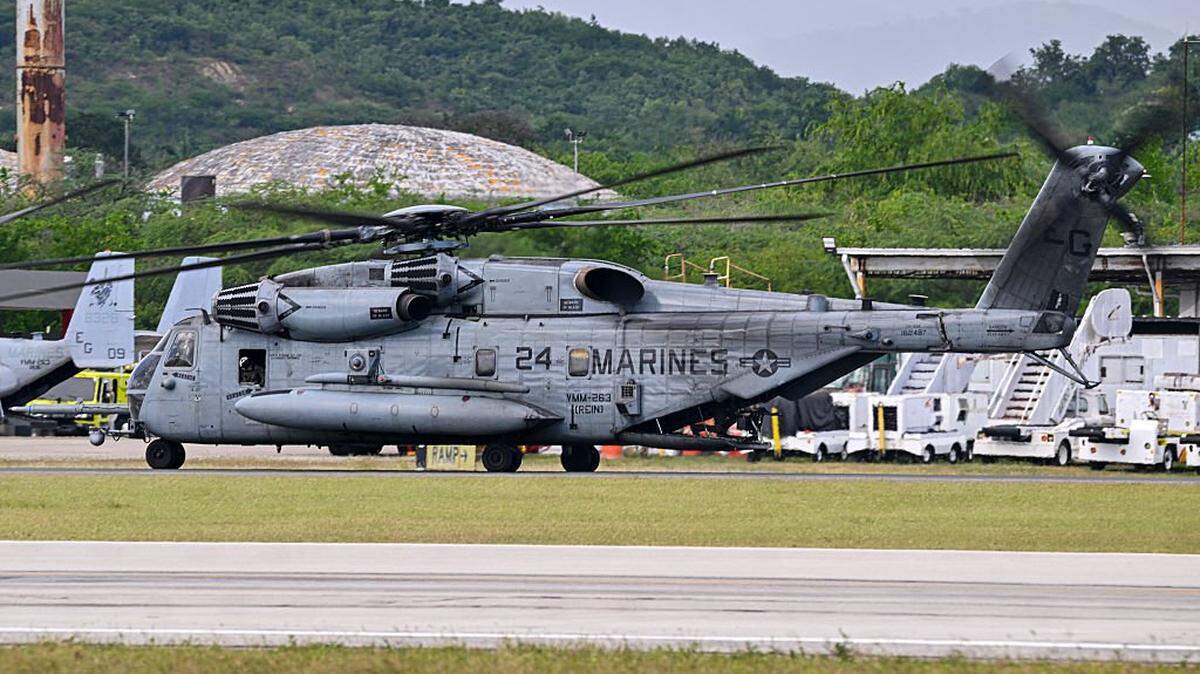 A US Marine CH-53 Sea Stallion taxis at Mercedita International Airport on December 16, 2025 in Ponce, Puerto Rico. Aircraft movements and coordinated exercises were observed throughout the day as part of heightened regional military readiness linked to ongoing operations at US military bases and maritime security efforts in the Caribbean. President Donald Trump administration is conducting a military campaign in the Caribbean and eastern Pacific, deploying naval and air forces for what it calls an anti-drugs offensive. (Photo by Miguel J. Rodriguez Carrillo / AFP via Getty Images)