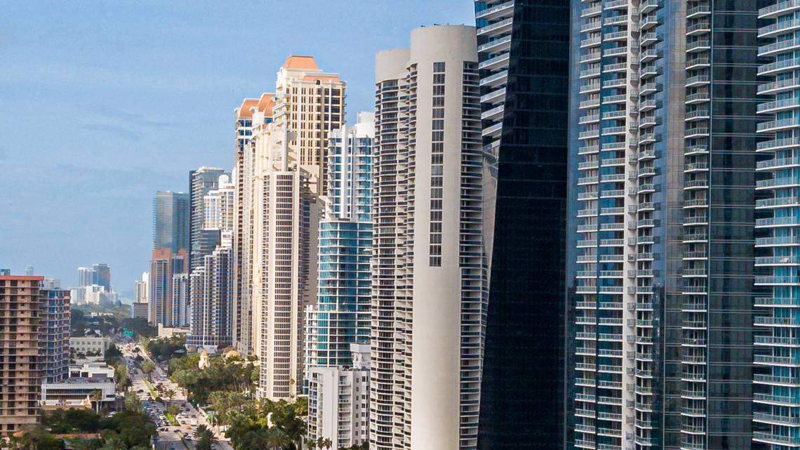 A new law limits the ability of foreigners from seven countries to buy real estate in Florida. Above: This is an aerial photo of condominiums lining Collins Avenue in Sunny Isles Beach, often called Little Moscow.