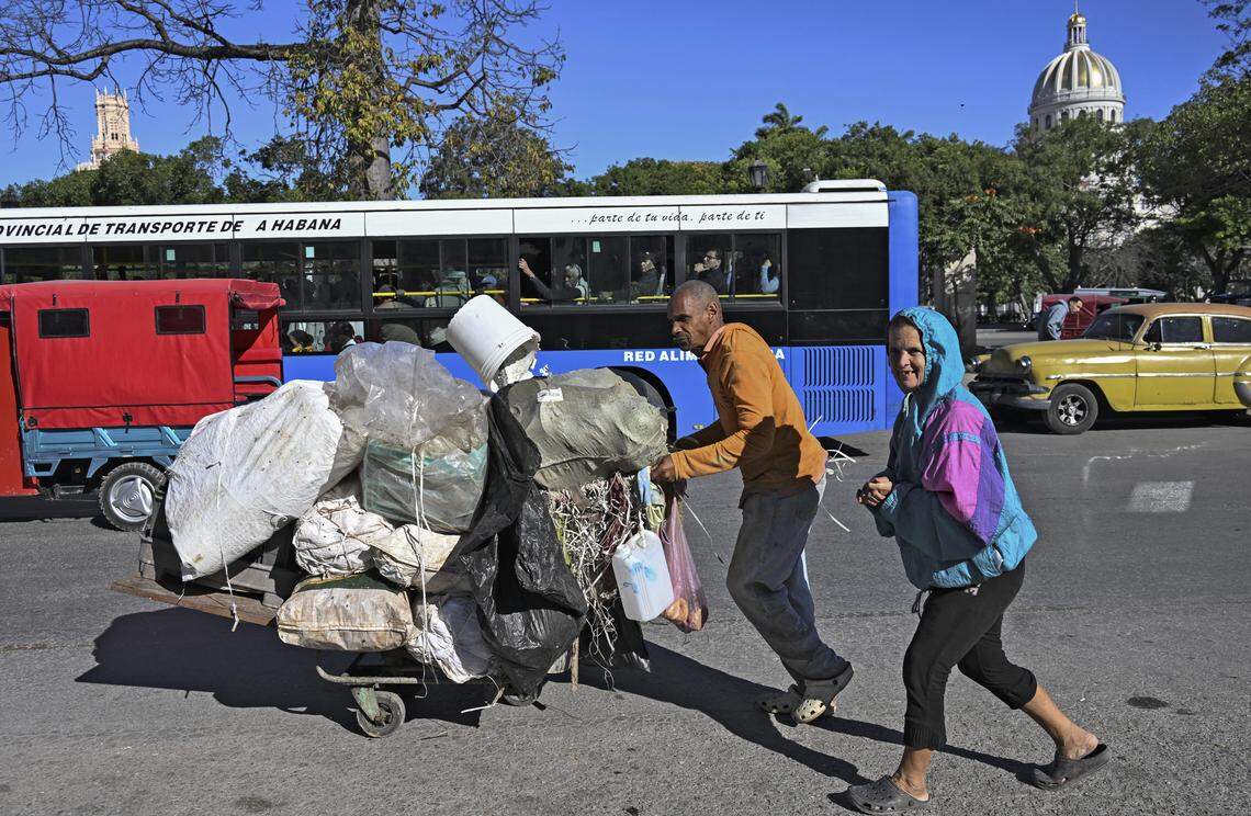 A man transports raw materials in a cart along a street in Havana on Feb. 25, 2026. 