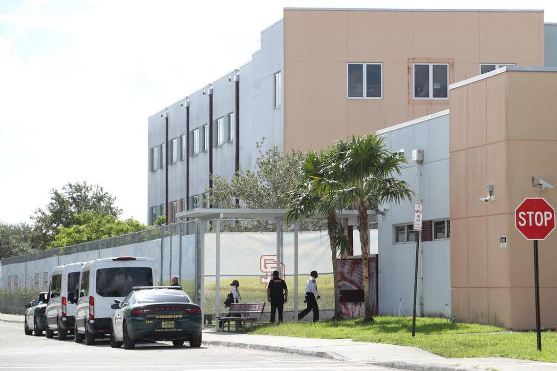 Court deputies exit vans that transported jurors to Marjory Stoneman Douglas High School in Parkland, Florida, on Thursday, Aug. 4, 2022, to view the “1200 building,” the crime scene where the 2018 shootings took place.