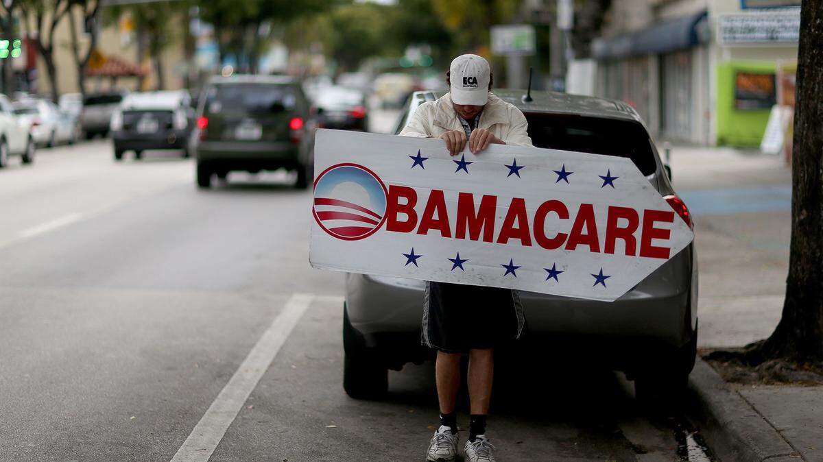 A Miami insurance company advertises to sign people up for the Affordable Care Act, also known as Obamacare, in 2015.