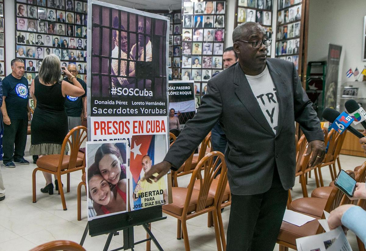 Jorge Luis Garcia Perez Antúnez, former Cuban political prisoner displays pictures of Cubans in jail that protested last year during a press conference called by the Assembly of the Cuban Resistance, at the Bay of Pigs Invasion’s Brigade 2506 headquarters in Little Havana to announce announce a series of activities to commemorate the first anniversary of the July 11 mass protests in Cuba, on Thursday July 07, 2022.