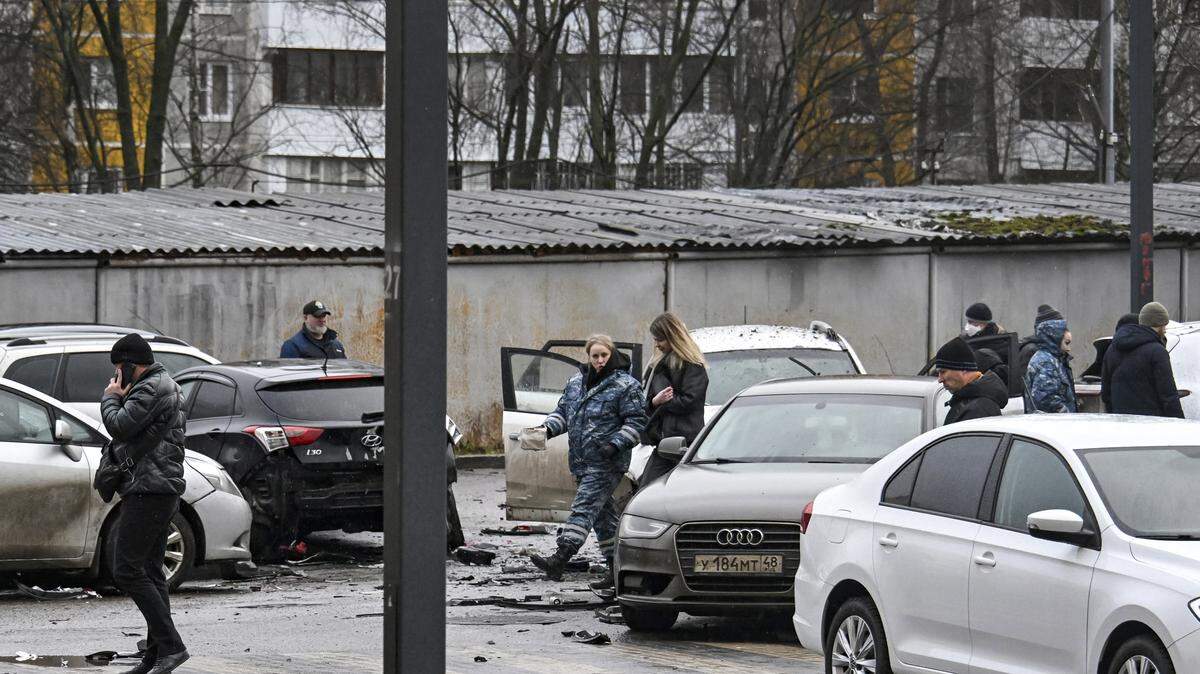 Investigators work at the car blast site in southern Moscow on December 22, 2025. Lieutenant General Fanil Sarvarov, head of the training department within the General Staff, was killed in Moscow on December 22, 2025 after an explosive device placed under his car went off, investigators said in a statement. (Photo by Alexander NEMENOV / AFP via Getty Images)