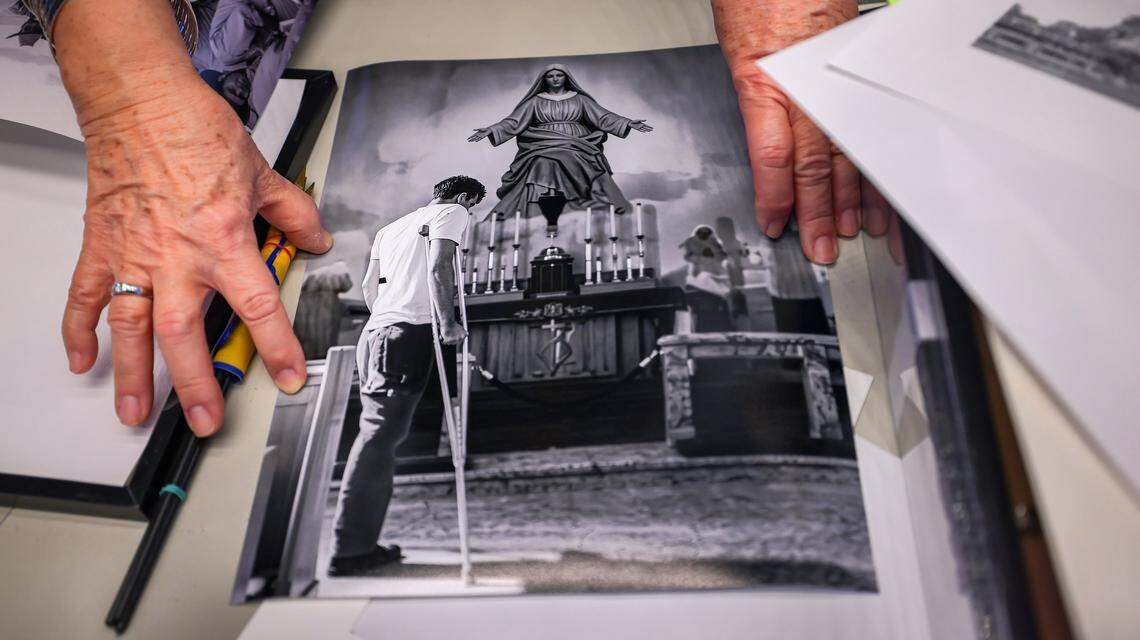 The curator of the new Bay of Pigs Brigade 2506 Museum, Carmen Valdivia, shares a photo of a Bay of Pigs veteran praying at Mercy Hospital, which is part of the exhibit, on Wednesday, April 15, 2026, in Miami, Florida. The new 11,000-square-foot Bay of Pigs Brigade 2506 Museum in Little Havana, Miami, is opening on April 18, and features interactive exhibits honoring the Cuban exiles who fought in the 1961 Bay of Pigs invasion.