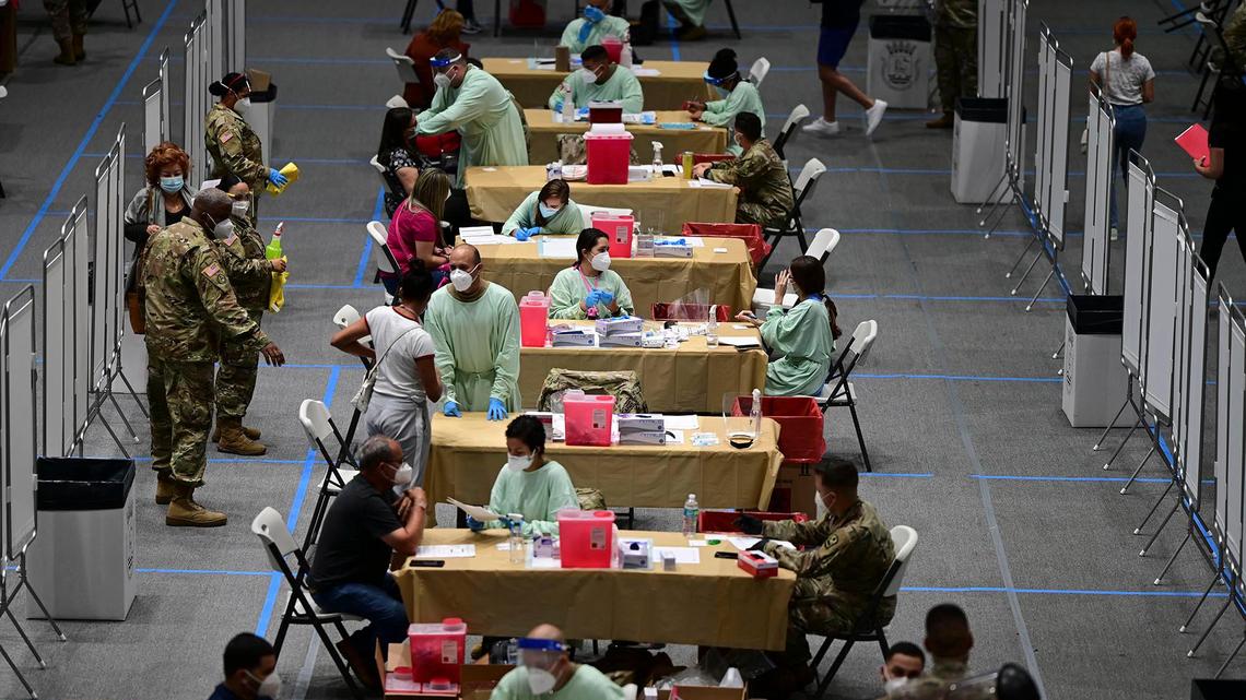 Healthcare workers received the COVID-19 vaccine at the Pedrín Zorrilla Colliseum in San Juan, Puerto Rico, on Dec. 30, 2020.