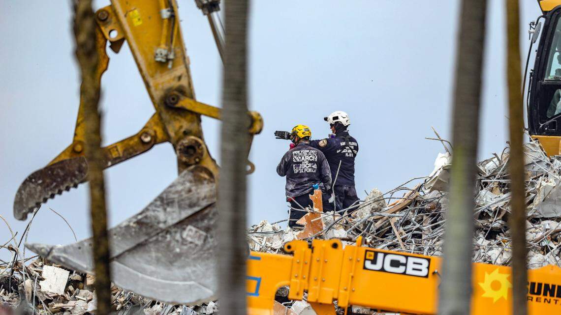 Seach crews moved debris on July 10, 2021, on the site of the collapsed Champlain Towers South condominium tower. Miami-Dade County’s Unsafe Structures Board is pressing for quicker hearings on building violations after the catastrophe.