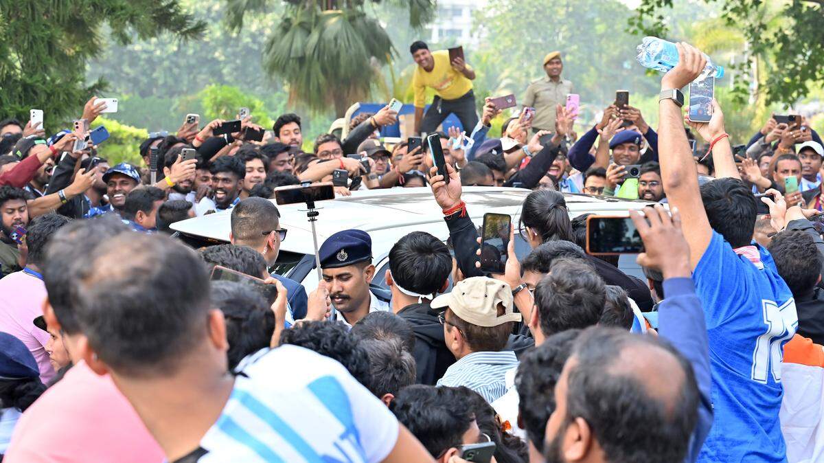 KOLKATA, INDIA - DECEMBER 13: Fans surround the car in which international footballers Lionel Messi and Rodrigo De Paul of Argentina and Luis Suarez of Uruguay were travelling out of Vivekananda Yuva Bharati Krirangan (VYBK) during the Lionel Messi G.O.A.T Tour on December 13, 2025 in Kolkata, India. (Photo by Ayush Kumar/Getty Images)