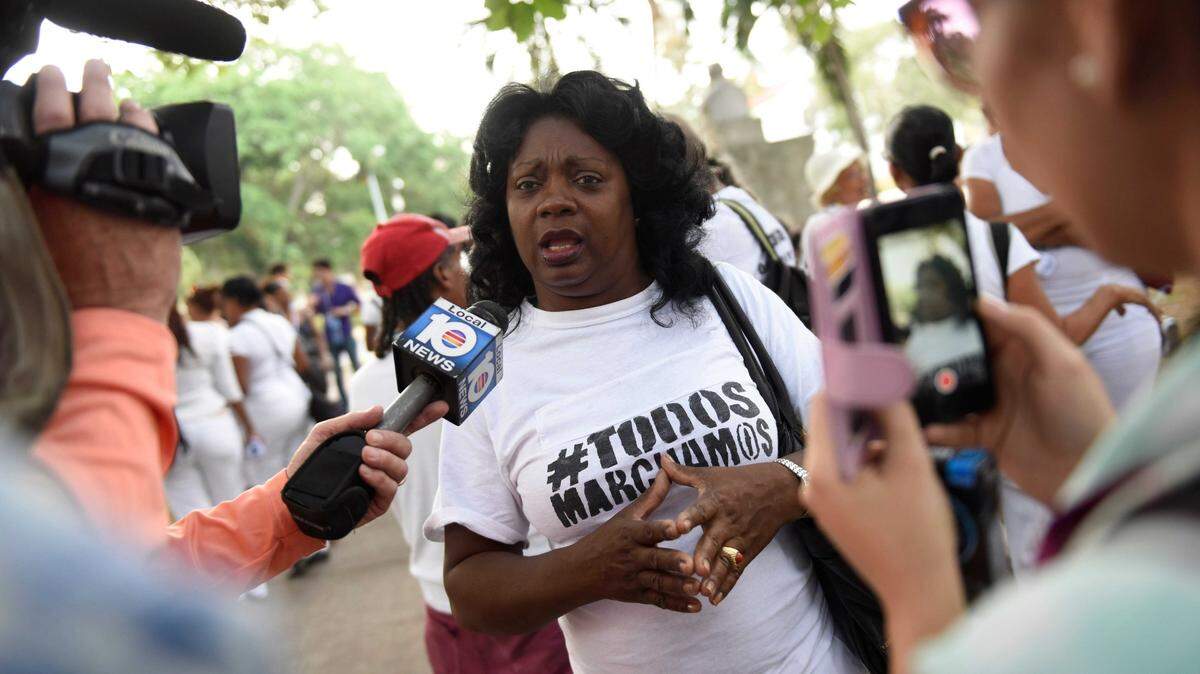 Mar 20, 2016; Havana, Cuba; Berta Soler, one of the original members of the Ladies in White, a group that protests against the Cuban government, is interviewed before the start of their weekly protest march. The group formed in 2003 after 75 human rights activists, dissidents and journalists were arrested by Cuban authorities Mandatory Credit: Jack Gruber-USA TODAY NETWORK
