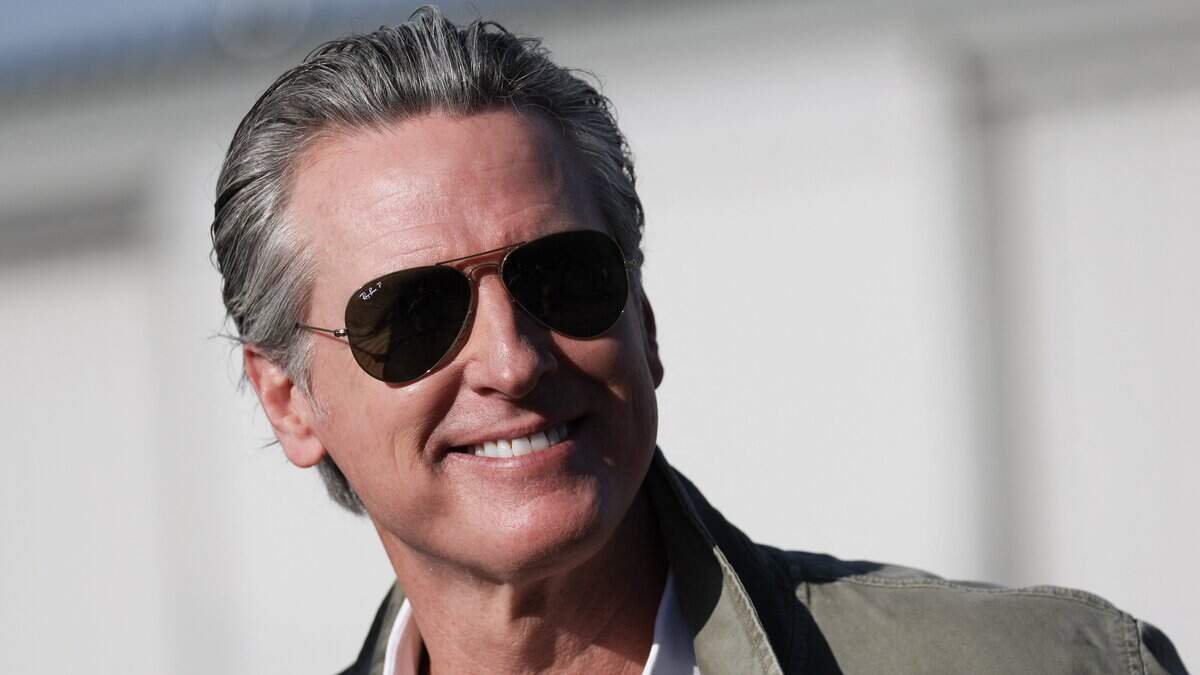California Governor Gavin Newsom departs from a press conference with the California National Guard and California Highway Patrol (CHP) about seizures of illicit drugs including fentanyl and border security operations during a press conference at Montgomery-Gibbs Executive Airport in San Diego, California on February 2, 2026. (Photo by Patrick T. Fallon / AFP via Getty Images)