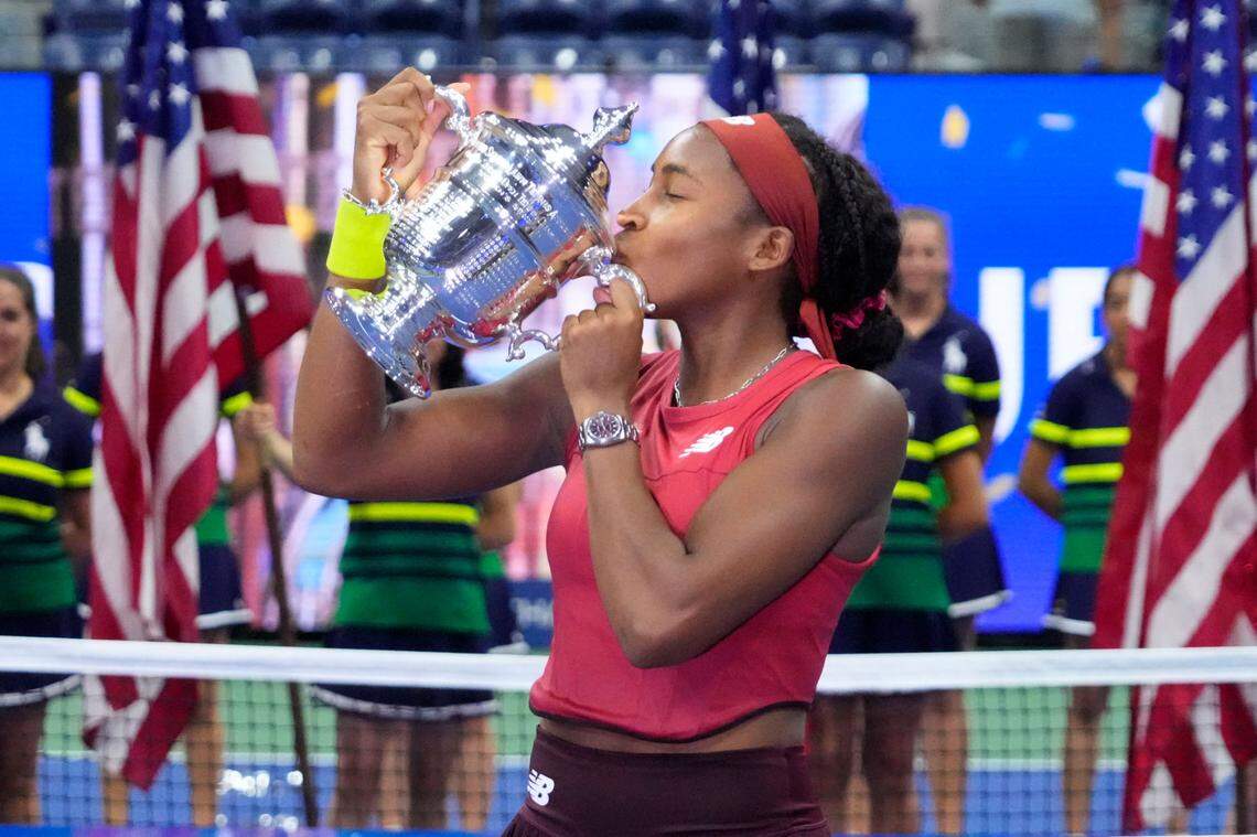 Coco Gauff of the United States celebrates with the championship trophy after her match against Aryna Sabalenka in the women’s singles final on day 13 of the 2023 US Open tennis tournament at the USTA Billie Jean King Tennis Center on September 9, 2023 in Flushing, New York.