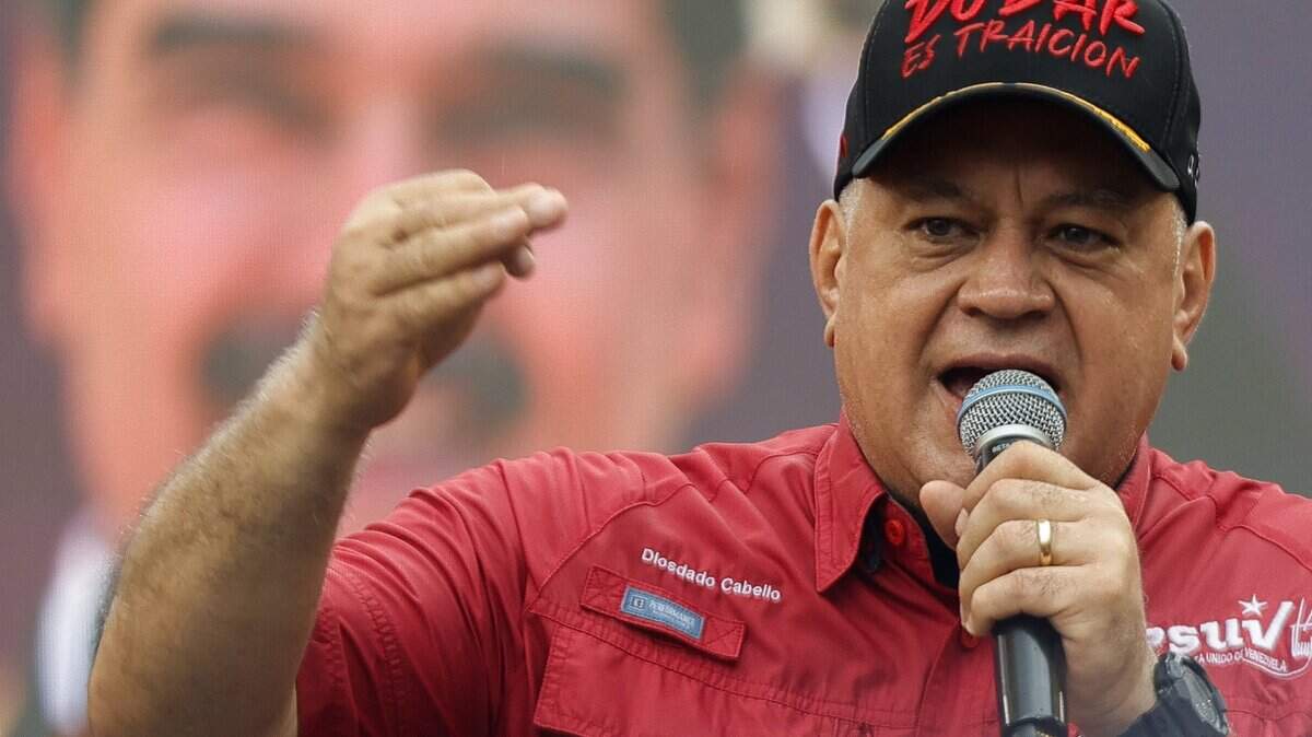 Venezuela's Minister of the Interior and Justice, Diosdado Cabello, gestures as he speaks during a demonstration by supporters of ousted President Nicolas Maduro calling for the release of him and his wife from a US prison in Caracas on January 23, 2026. Thousands of Nicolas Maduro's supporters marched in Caracas on January 23, calling for the release of the ousted president, as Venezuela marked the 68th anniversary of the fall of military dictatorship. (Photo by Pedro MATTEY / AFP via Getty Images)