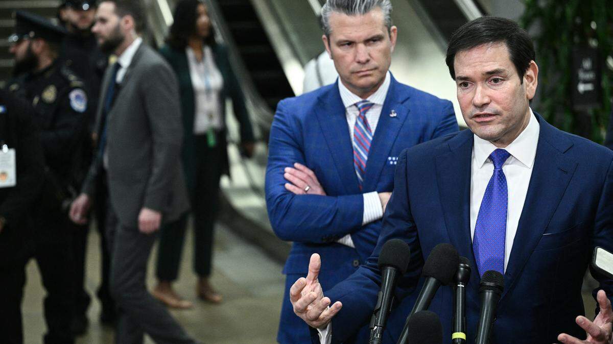 (L/R) US Secretary of Defense Pete Hegseth and US Secretary of State Marco Rubio speak to reporters after they briefed Senators on the recent US military actions in Venezuela, on Capitol Hill in Washington, DC on January 7, 2026. (Photo by Brendan SMIALOWSKI / AFP via Getty Images)