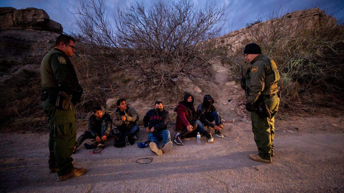In March, Customs and Border Protection agents in Sunland Park, New Mexico, apprehend migrants from Guatemala and Mexico, who entered the US without proper documentation.