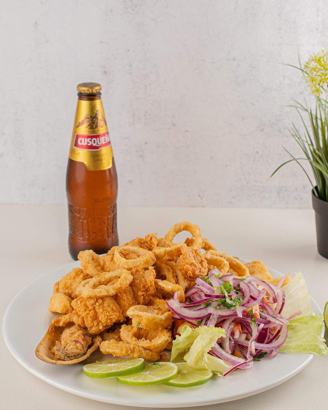Enjoy a cold Cusqueña beer alongside your favorite Peruvian food.