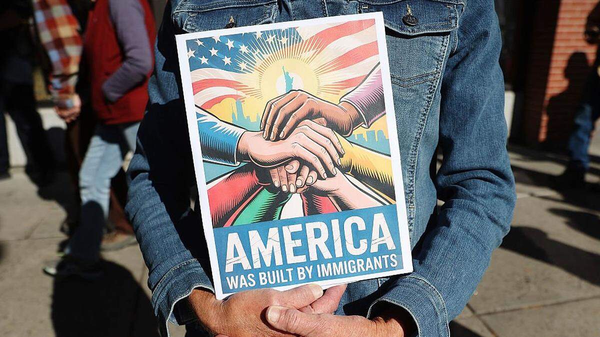 BOZEMAN, MONTANA - OCTOBER 18: A protestor holds a sign during the No Kings Rally on October 18, 2025 in Bozeman, Montana. (Photo by Janie Osborne/Getty Images for No Kings)