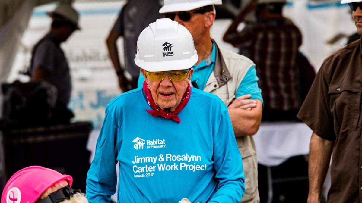 Former President Jimmy Carter works on one of the homes at the Jimmy and Rosalynn Carter Work Project for Habitat for Humanity Edmonton in Canada.