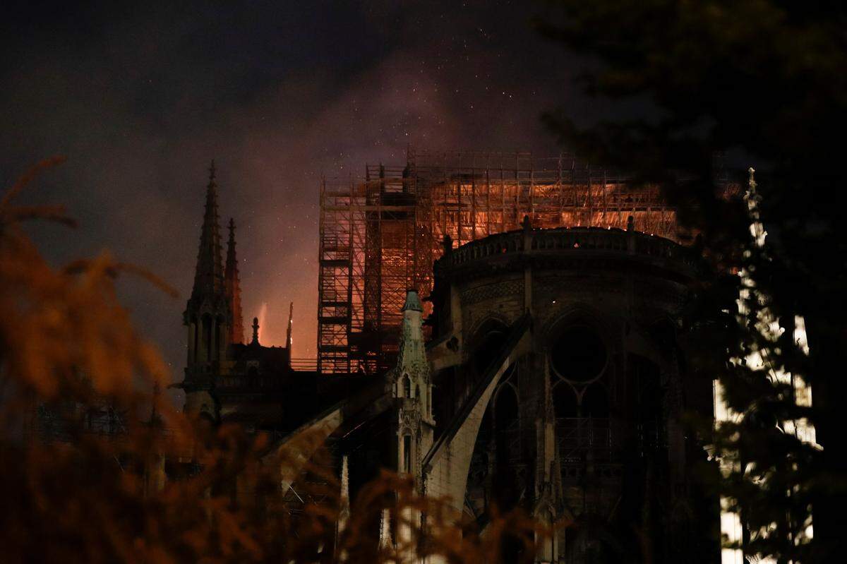 Flames billow from the roof at Notre Dame Cathedral in Paris on April 15, 2019. A fire broke out at the landmark Notre Dame Cathedral in central Paris, potentially involving renovation works being carried out at the site, the fire service said.