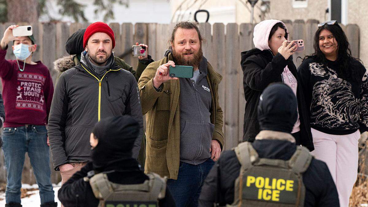 Observers record ICE agents in Minnesota. A state Senate bill under consideration in Kansas would make it a crime to do that within 25 feet of them.