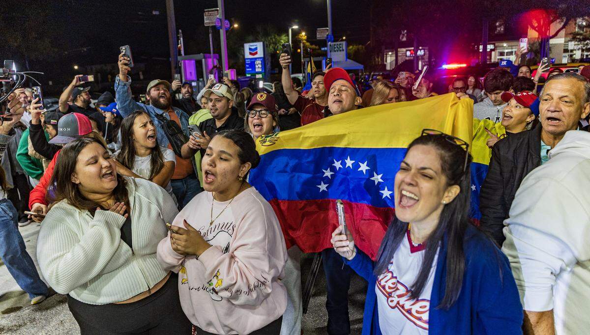 Venezuelans exiles living in South Florida celebrated outside of El Arepazo in Doral, Florida, after the United States attacked Venezuela and captured Venezuelan leader Nicolás Maduro,  on Jan. 3, 2026.