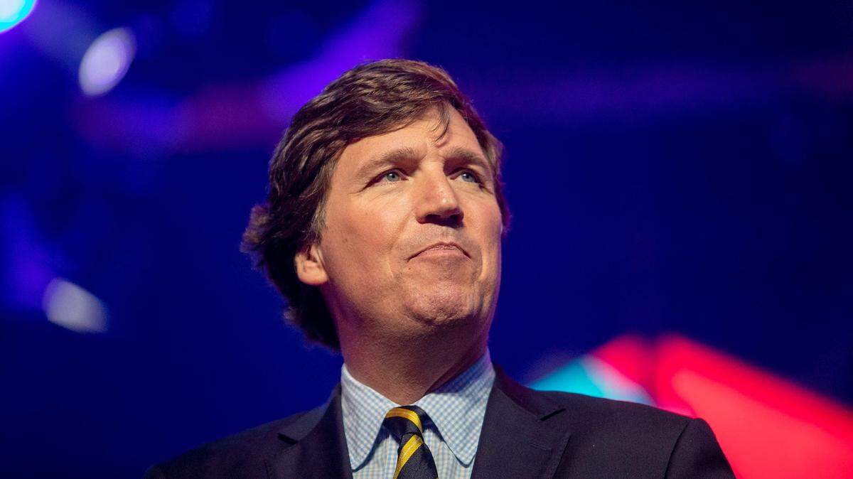 Tucker Carlson talks during America Fest 2021 organized by Turning Point USA Dec. 18, 2021, in Phoenix.