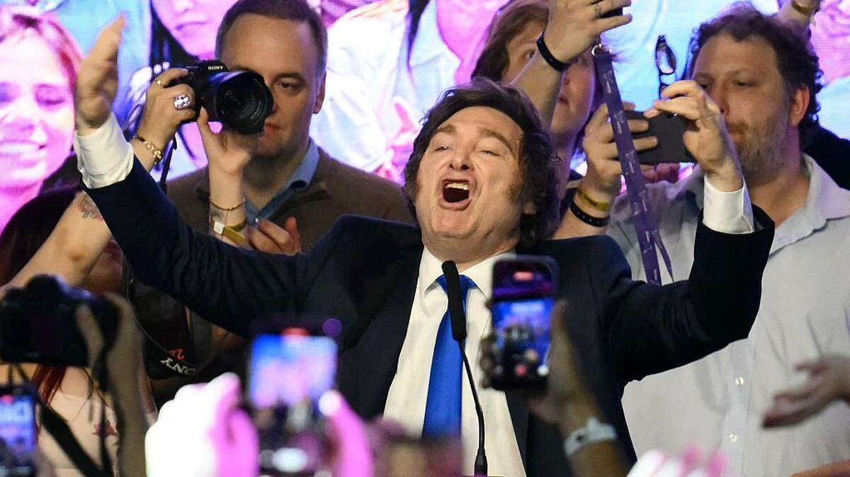 Argentina's President Javier Milei celebrates at the ruling party's La Libertad Avanza headquarters following the results of the national midterm legislative election in Buenos Aires on October 26, 2025. Argentina's budget-slashing leader Javier Milei pulled off a stunning win in Sunday's midterm elections, boosting the flagging reform agenda of the US-backed right-winger. (Photo by Luis ROBAYO / AFP) (Photo by LUIS ROBAYO/AFP via Getty Images)