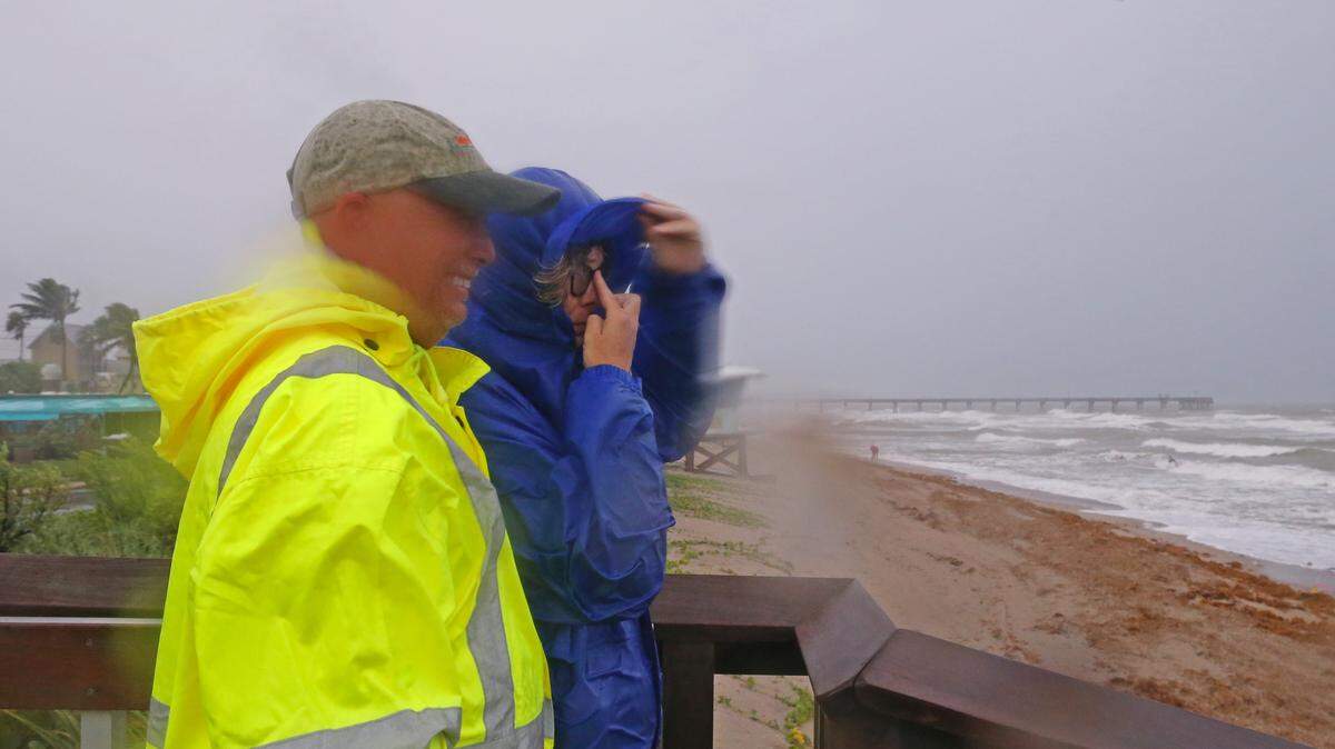 A file photo from 2018 shows George and Paulette Haines watching waves from Tropical Storm Gordon pounding beaches. Similar wet weather on Sept. 15, 2023, and forecast for a full week ahead, are not the result of a tropical storm but a couple fronts that will bring thunderstorms, possible flooding, and rough seas and rip currents to South Florida beaches.