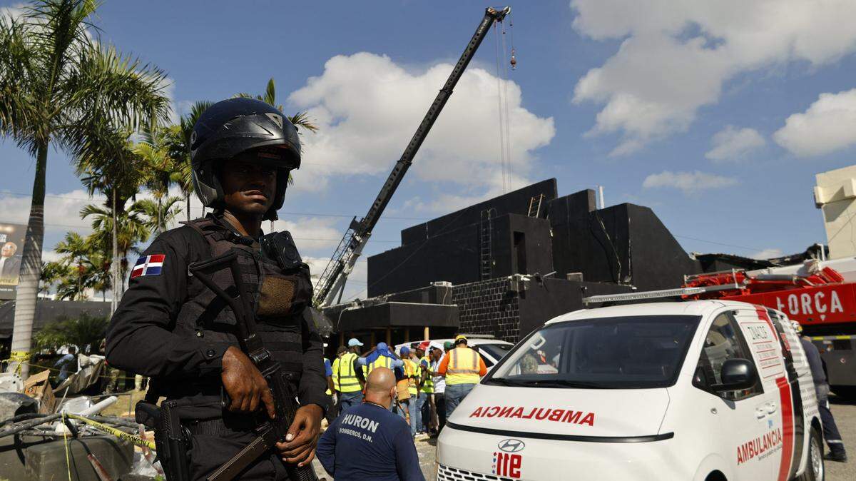 A police officer guards the site where the roof of the Jet Set nightclub collapsed in Santo Domingo, Dominican Republic, on April 8, 2025.
