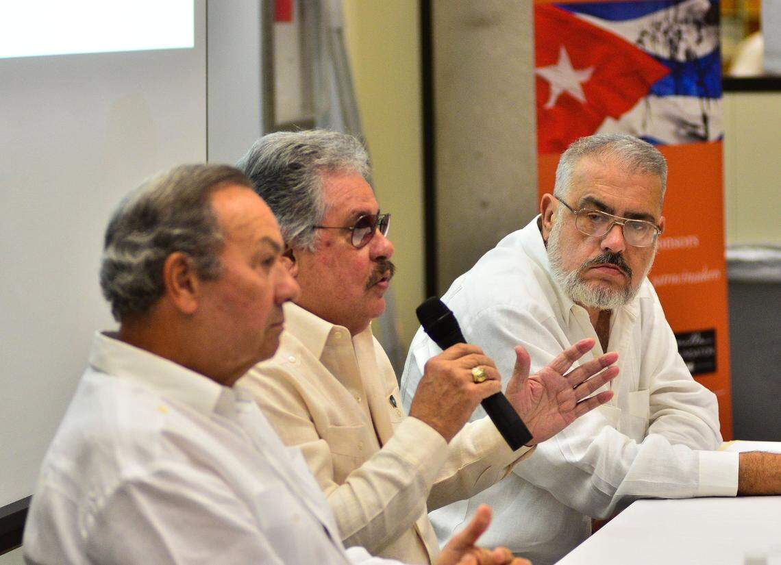 L-R Humberto J. Cortina, president of HJC Consultants and veteran of Bay of Pigs, Captain Amado Cantillo, Presidente of Cuban Pilot Association and active member of Brigade 2506, and Enrique Encinosa, author and radio personality, giving a lecture on the Bay of Pigs invasion at the West Dade Regional Library in Miami on August 8th 2013.