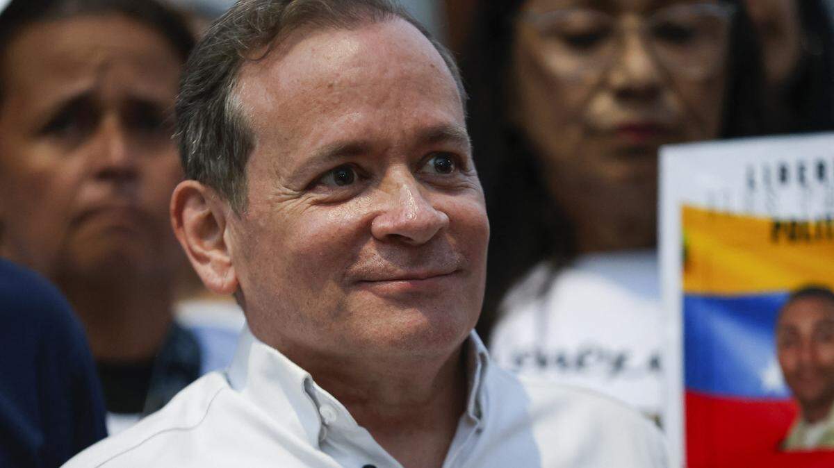 Venezuelan political leader Juan Pablo Guanipa gestures after their release from Helicoide prison in Caracas on February 8, 2026. Two opposition figures close to Venezuela's Nobel peace laureate Maria Corina Machado were freed from jail on February 8, 2026, one month after authorities began releasing political prisoners following the ouster of leader Nicolas Maduro. (Photo by Pedro MATTEY / AFP via Getty Images)