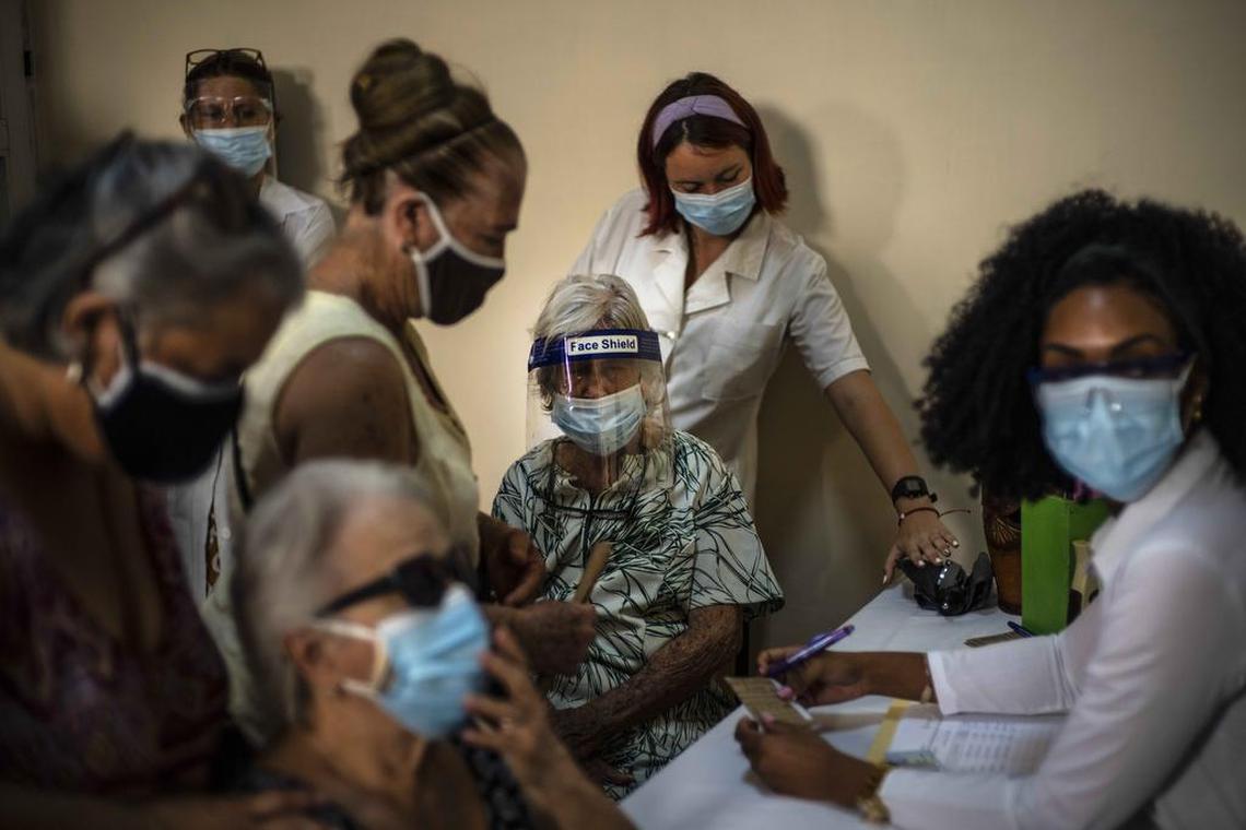 In a photo from June, residents of Havana line up for vaccine doses. The country is struggling with rising cases and deaths.