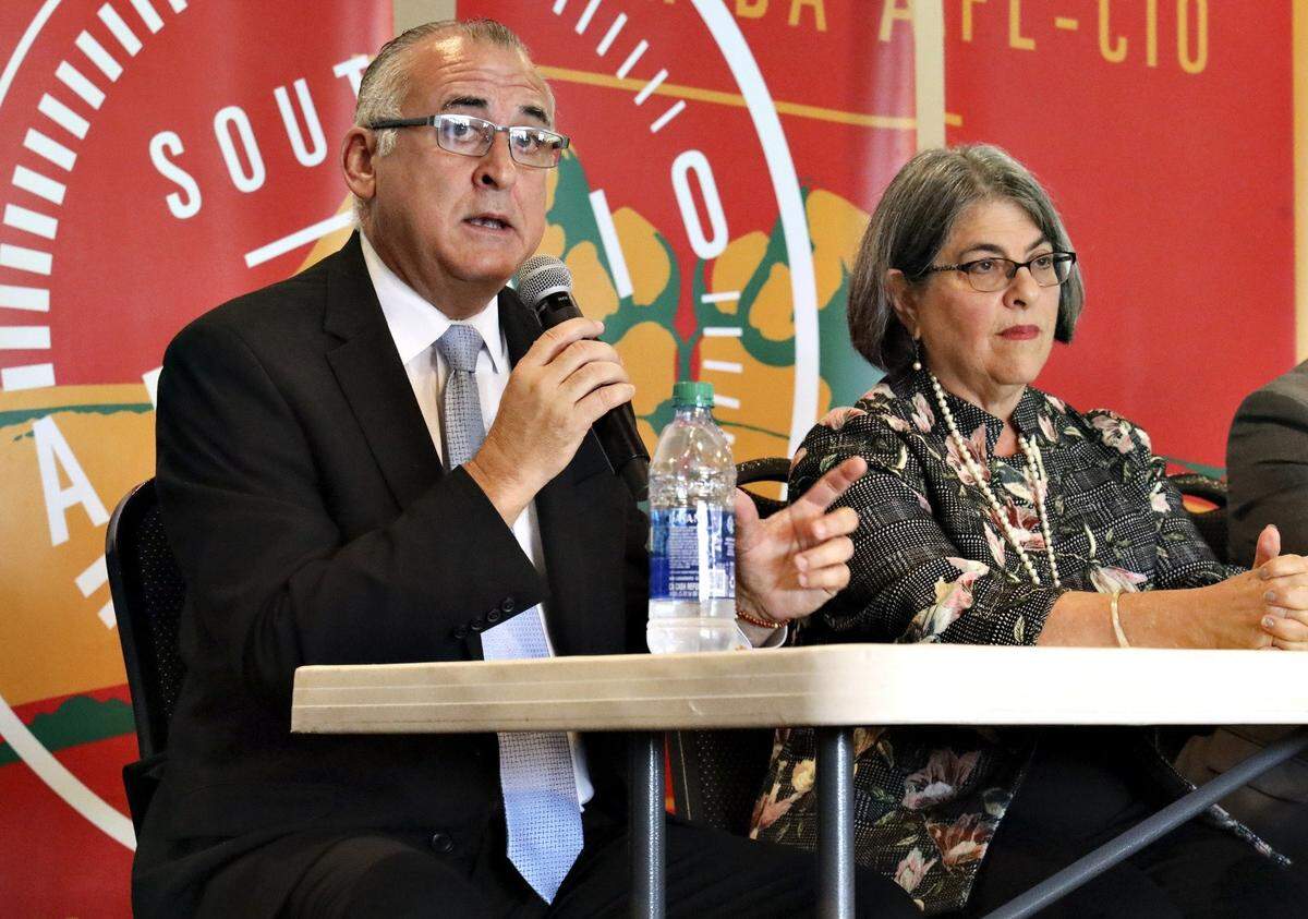 Miami-Dade Commissioners Esteban “Steve” Bovo and Daniella Levine Cava speak at a forum for the 2020 mayoral race in Miami-Dade County.