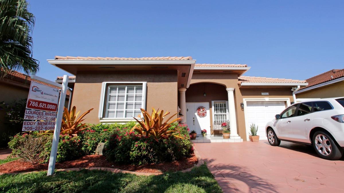 “If you are in the market, you can raise your price horizon and still secure a somewhat lower mortgage rate,” writes Lew Sichelman in his weekly real estate column. Above: A photo of a house for sale in 2020 in Miami.