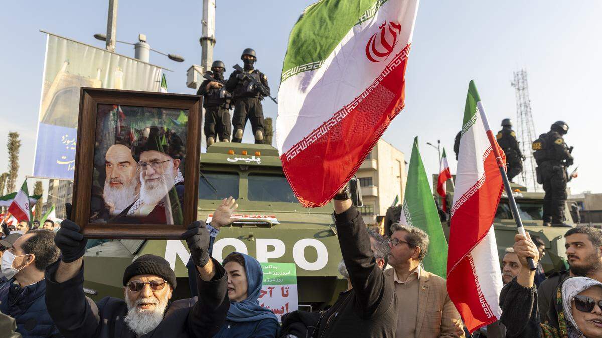 TEHRAN, IRAN - JANUARY 12: People attend a pro-government rally on January 12, 2026 in Tehran, Iran. Tens of thousands of demonstrators gathered in Tehran's Enqelab Square on Monday, as Mohammad Bagher Ghalibaf, speaker of the Iranian parliament, made a speech denouncing western intervention in Iran, following ongoing anti-government protests. In recent days, US President Donald Trump has repeatedly threatened military action if Iranian security forces kill protesters. (Photo by Stringer/Getty Images)