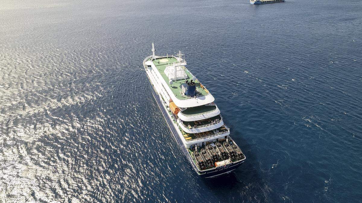 TOPSHOT - This aerial picture shows a general view of the cruise ship MV Hondius stationary off the port of Praia, the capital of Cape Verde, on May 3, 2026. An outbreak of "severe acute respiratory illness" on board a cruise ship in the Atlantic has left two people dead and a third in intensive care in Johannesburg, South Africa's health ministry told AFP on May 3, 2026.
The outbreak occurred on the MV Hondius, travelling from Ushuaia in Argentina to Cape Verde. The patient being treated in Johannesburg tested positive for a hantavirus, a family of viruses that can cause hemorrhagic fever, South African spokesperson Foster Mohale said. (Photo by AFP via Getty Images)