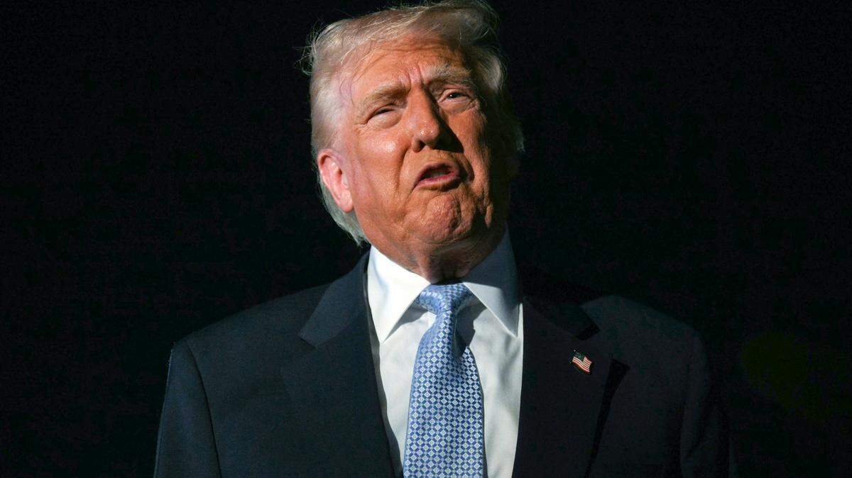 US President Donald Trump speaks with reporters before boarding Air Force One as he departs Palm Beach International Airport in West Palm Beach, Florida, on November 16, 2025. Trump is returning to the White House after spending the weekend at his Mar-a-Lago, Florida, residence. (Photo by Jim WATSON / AFP) (Photo by JIM WATSON/AFP via Getty Images)
