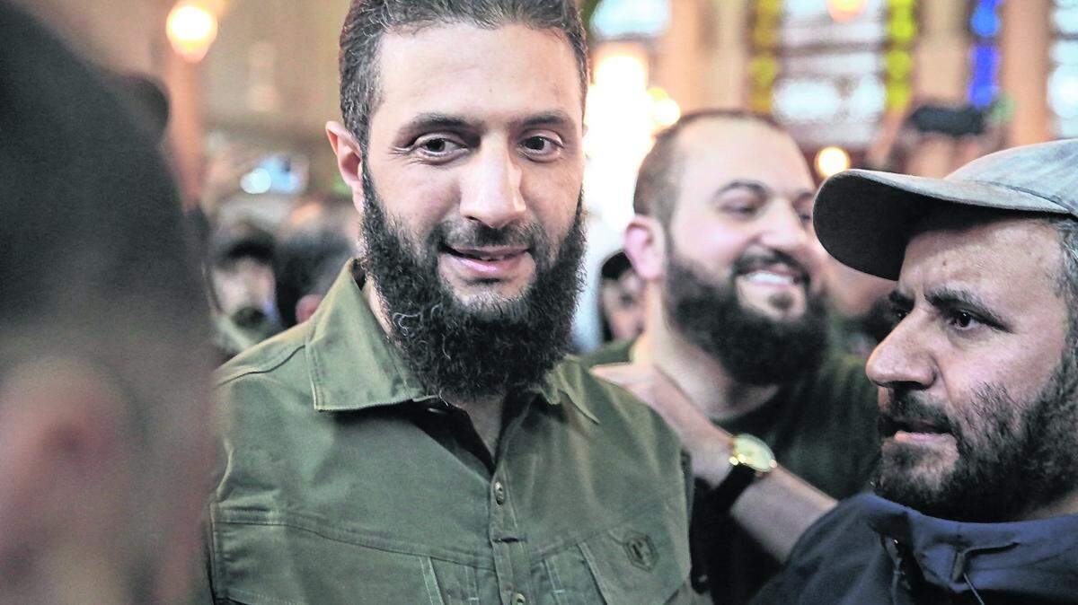 Supporters welcome the leader of Syria’s Islamist Hayat Tahrir al-Sham (HTS) group that headed a lightning rebel offensive snatching Damascus from government control, Abu Mohammed al-Golani (C), before his address at the capital’s landmark Umayyad Mosque on December 8. Golani, now using his real name Ahmed al-Sharaa, gave a speech as the crowd chanted “Allahu akbar (God is greatest),” a video shared by the rebels on their Telegram channel showed.