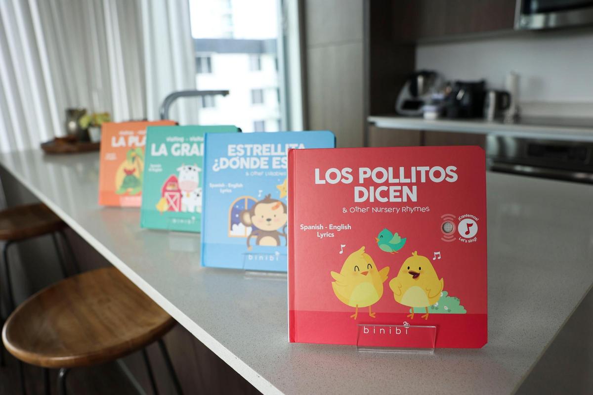 Children’s books by Ana Guzman sit in her kitchen on Monday, Oct. 24, 2022, in her apartment in Brickell. Los Pollitos Dicen is her best selling book.