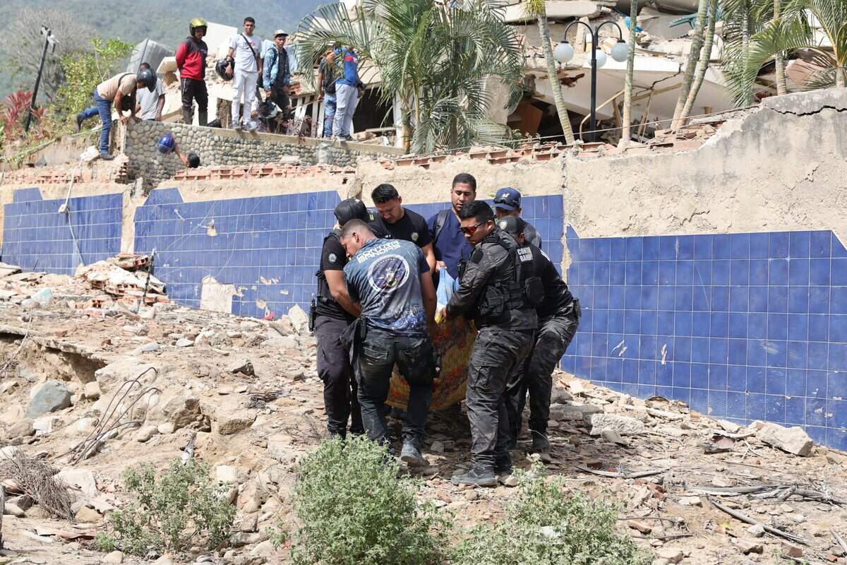 LA GUAIRA, VENEZUELA - JUNE 25: (EDITOR'S NOTE: Image depicts death.) Police members tend a victim amid debris of demolished buildings as rescue efforts continue after a magnitude 7.2 earthquake struck Venezuela and other regions in the Caribbean on June 25, 2026 in La Guaira, Venezuela. According to the U.S. Geological Survey (USGS), the main earthquake was followed by a 7.5-magnitude aftershock less than a minute later. The number of victims increased to 188 and over a 1500 injured. (Photo by Jesus Vargas/Getty Images)