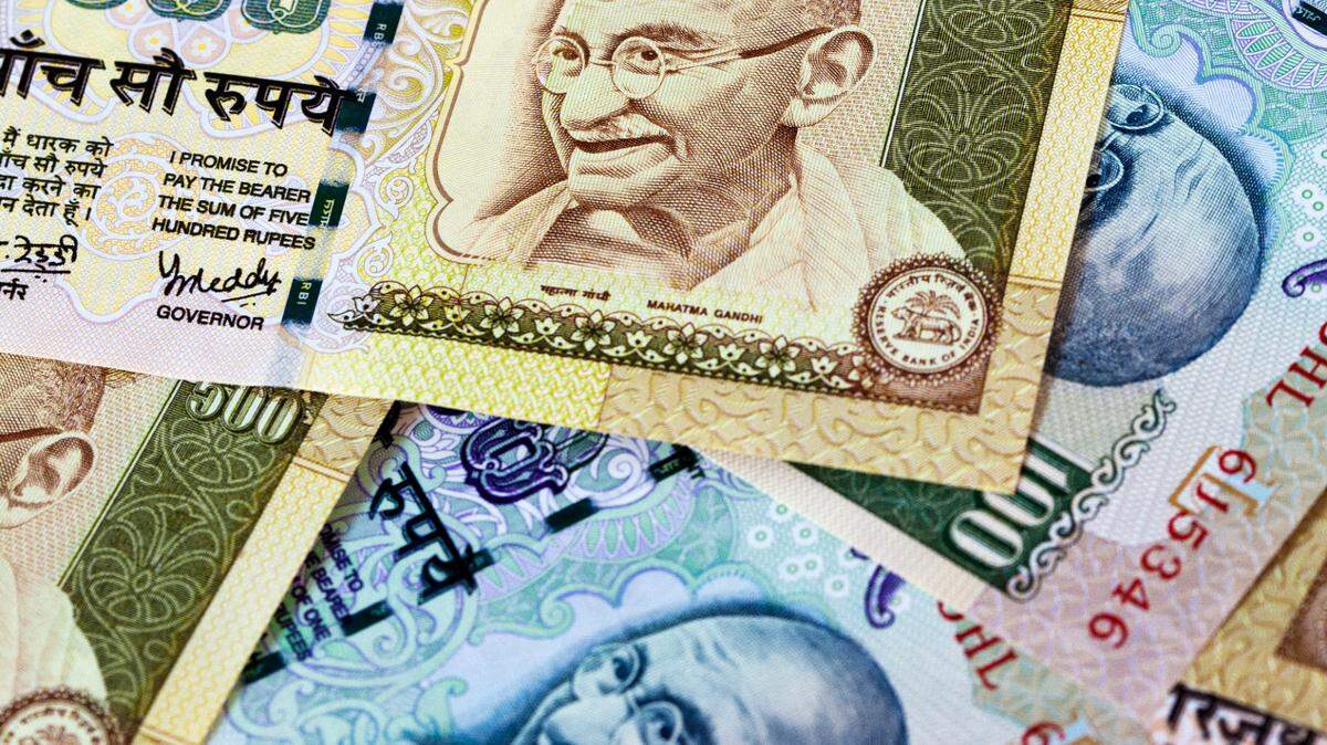 Pile Of 100 And 500 Indian Rupee Notes