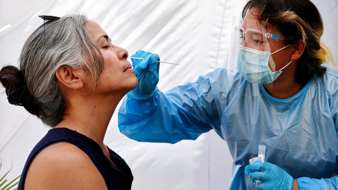 A medical worker administers a COVID-19 test in Los Angeles, California on July 14, 2021.