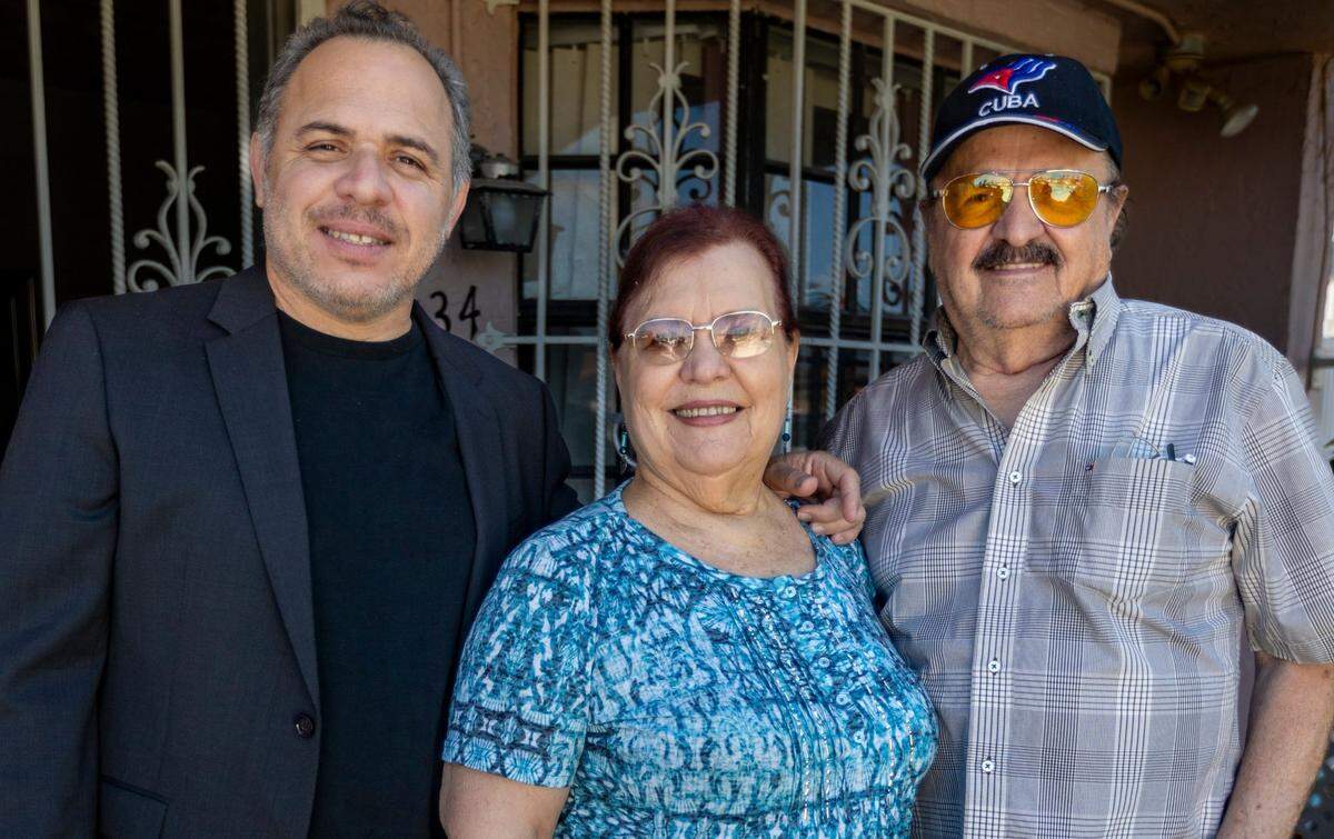 Cuban-American graphic designer and artist Edel Rodríguez, author of ‘Worm: A Cuban American Odyssey’, with his parents, Coralia Rodríguez and Cesario “Tato” Rodríguez, at their home in Hialeah Gardens.
