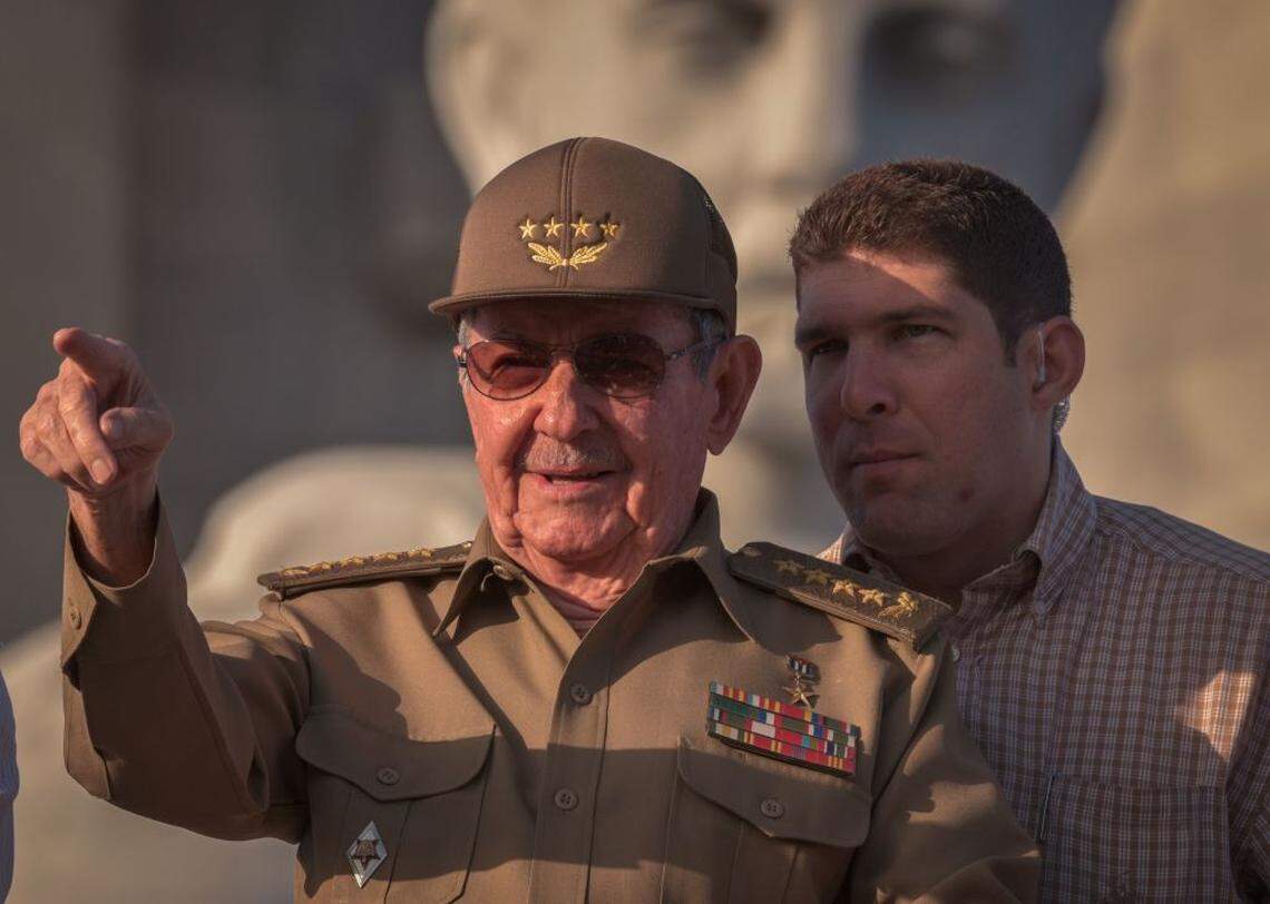 Raúl Castro next to his grandson and bodyguard, Raul Rodriguez Castro, attends the May Day parade at Revolution Square in Havana, on May 1, 2017.