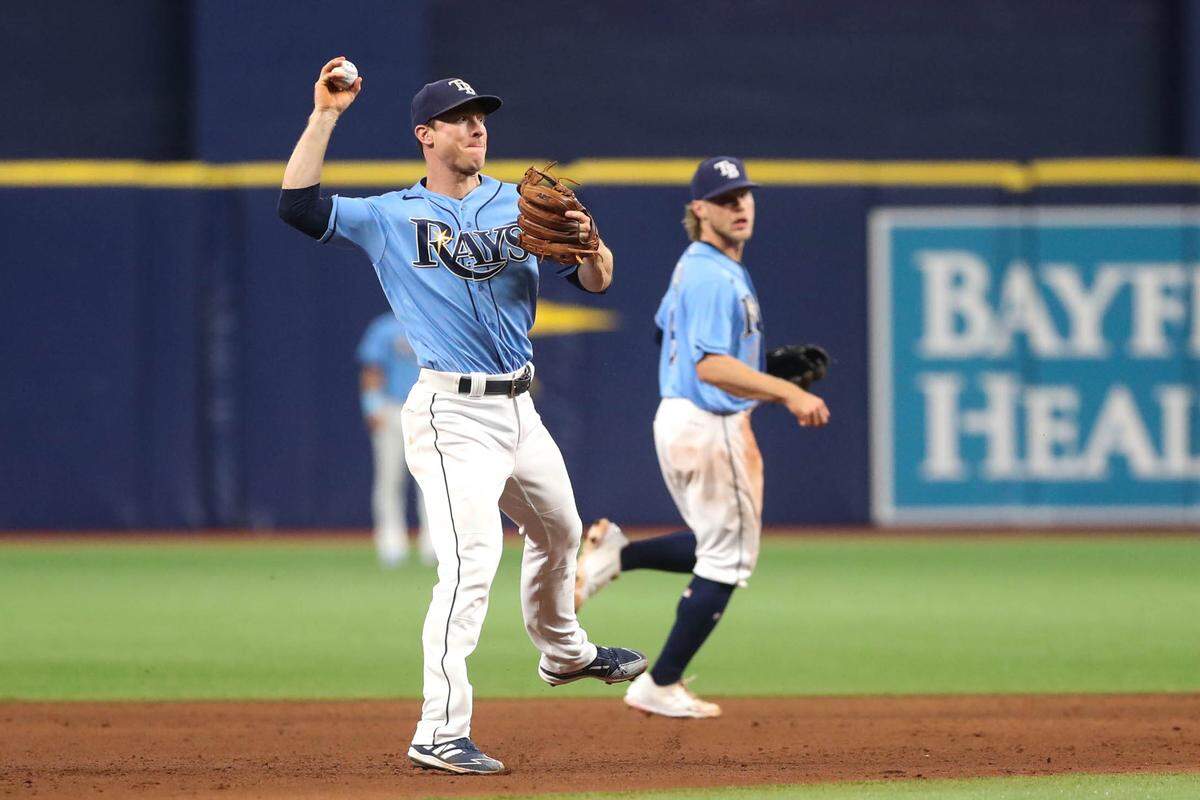Third baseman Joey Wendle throws to first base in the fifth inning of a game between the Tampa Bay Rays and Toronto Blue Jays and July 9, 2021, in St. Petersburg, Florida.
